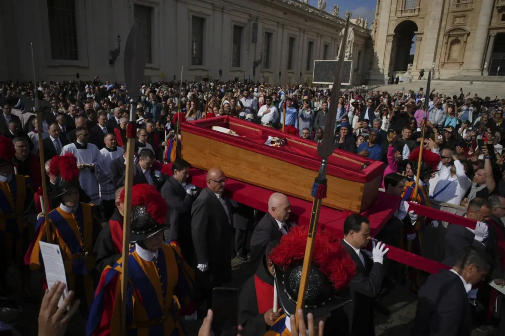 The body of Pope Francis is carried into St. Peter's Basilica at the Vatican, where he would lie in state for three days.